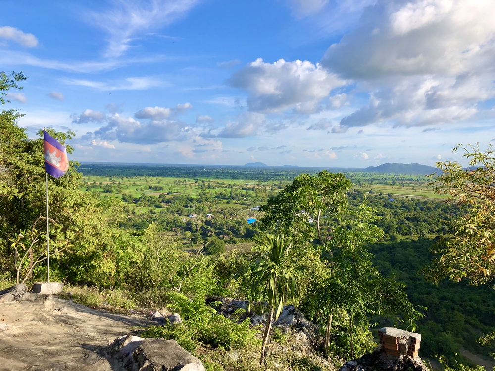 Cambodian countryside and flag view from Phnom Sampeau mountain